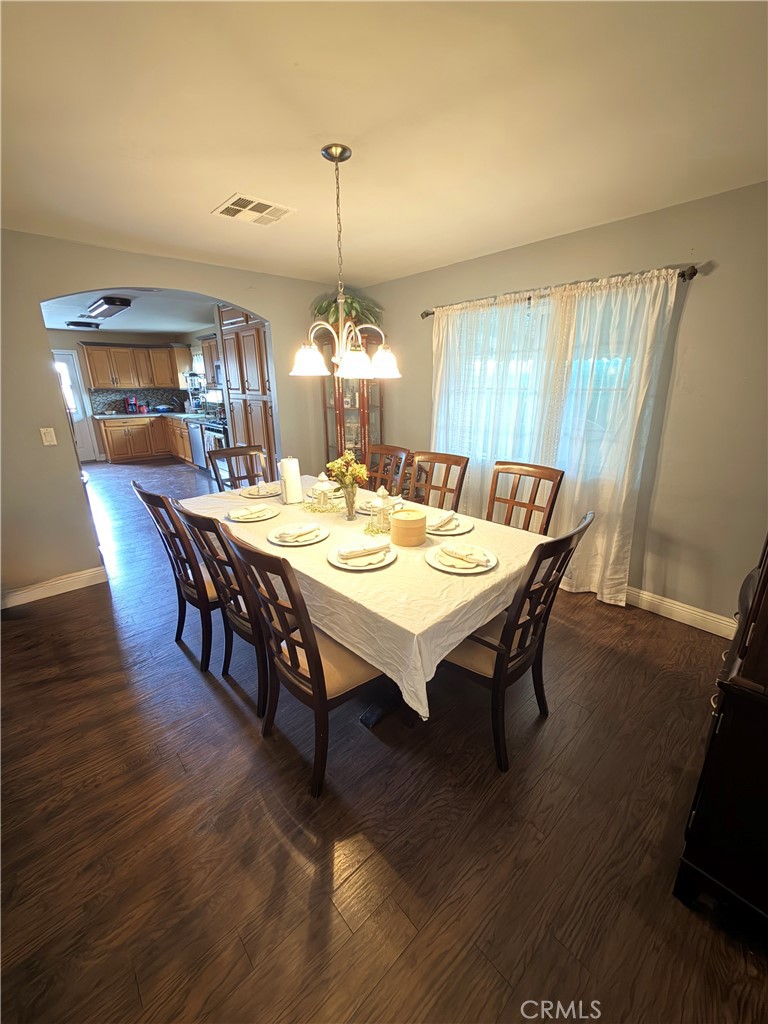 1896 Maryvale Lane Hemet, CA 92544 - Photo 6 of 33 a view of a dining room with furniture window and wooden floor