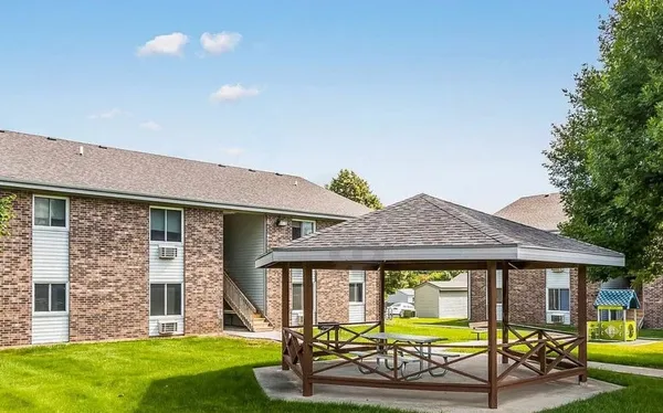 a front view of house with yard and outdoor seating