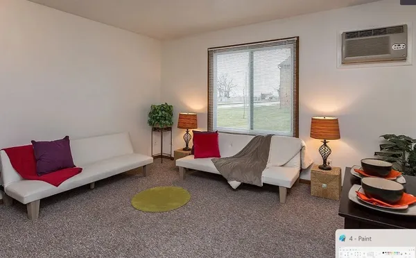 a living room with furniture and a window