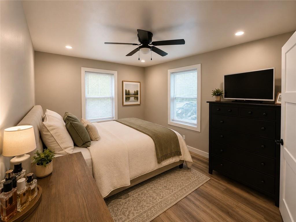 960 South Main Street Jasper, GA 30143 - Photo 8 of 12 a bedroom with a bed and a flat screen tv