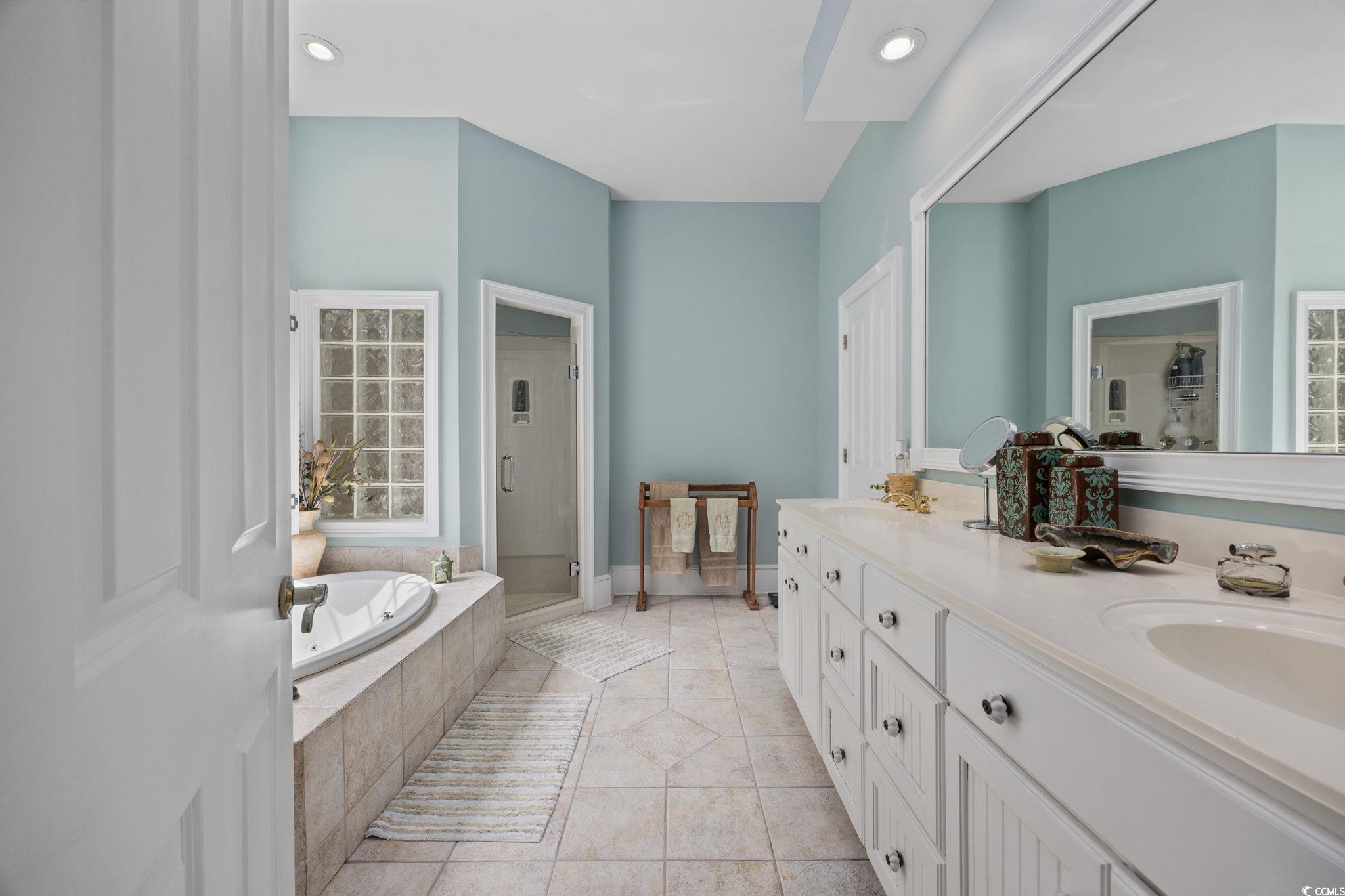 3750 Highway 813 Conway Sc 29526 Conway, SC 29526 - Photo 20 of 40 Full bath with double vanity, a garden tub, a shower stall, recessed lighting, and light tile patterned flooring