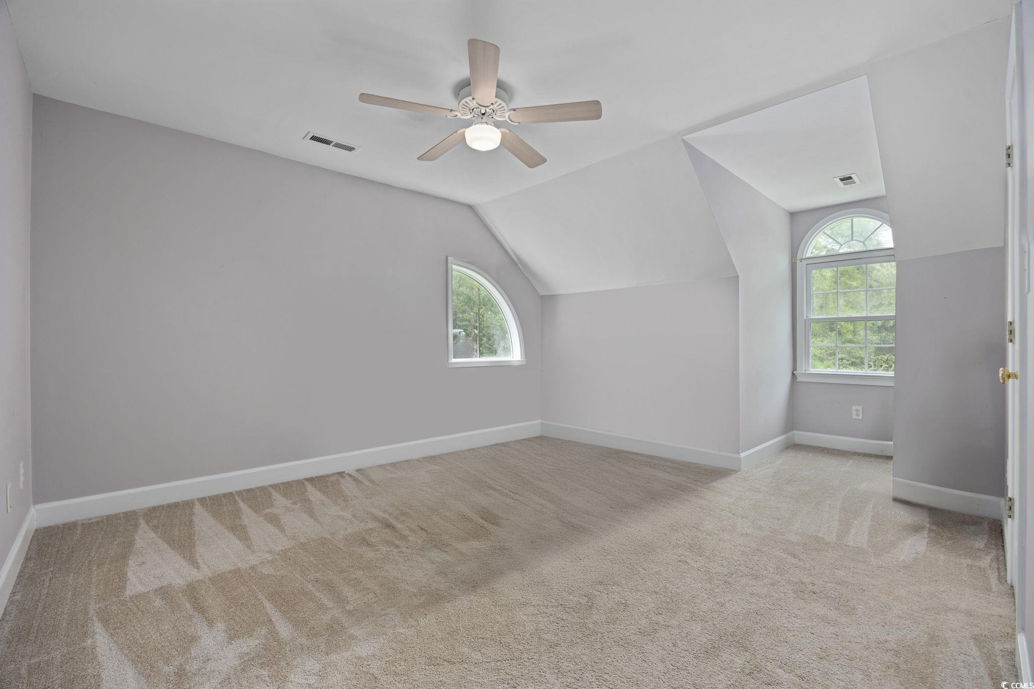 3750 Highway 813 Conway Sc 29526 Conway, SC 29526 - Photo 26 of 40 Bonus room with lofted ceiling, light colored carpet, plenty of natural light, and ceiling fan