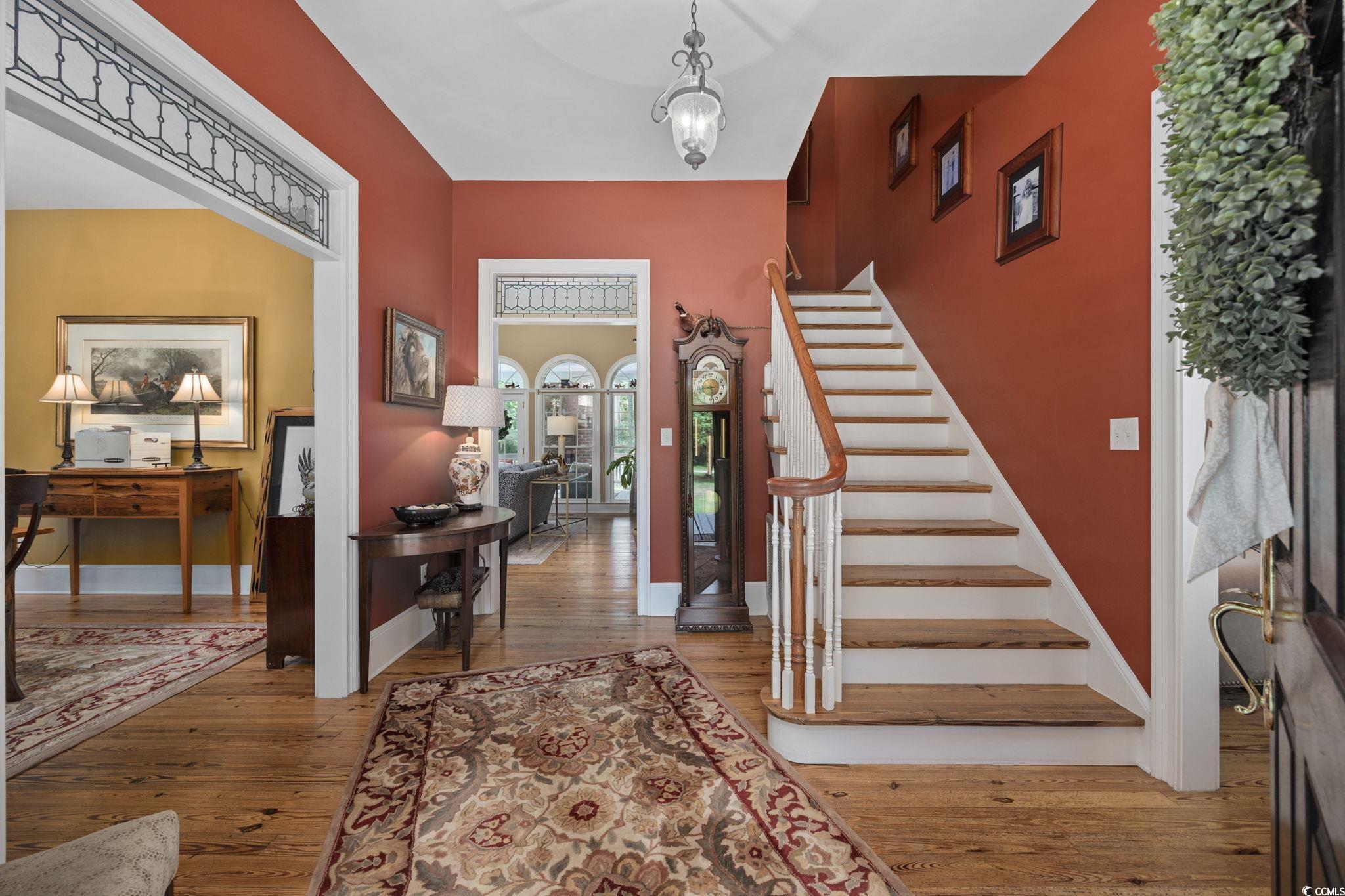 3750 Highway 813 Conway Sc 29526 Conway, SC 29526 - Photo 5 of 40 Foyer entrance featuring light wood-style floors, stairway, and a chandelier