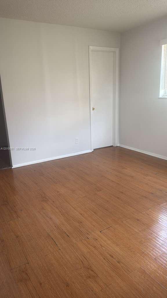7910 North Colony Circle, Unit 101 Tamarac, FL 33321 - Photo 13 of 17 a view of an empty room and window
