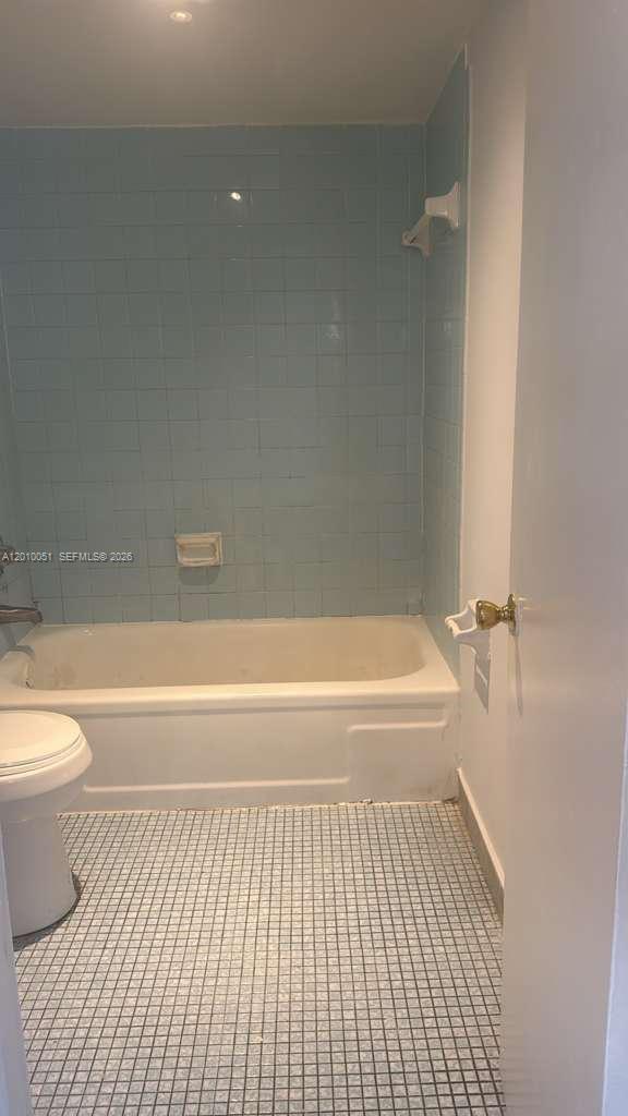 7910 North Colony Circle, Unit 101 Tamarac, FL 33321 - Photo 17 of 17 a bathroom with a toilet and a bathtub