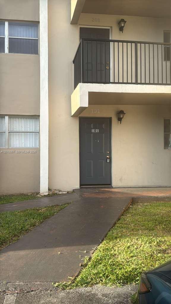 7910 North Colony Circle, Unit 101 Tamarac, FL 33321 - Photo 6 of 17 a front view of a house