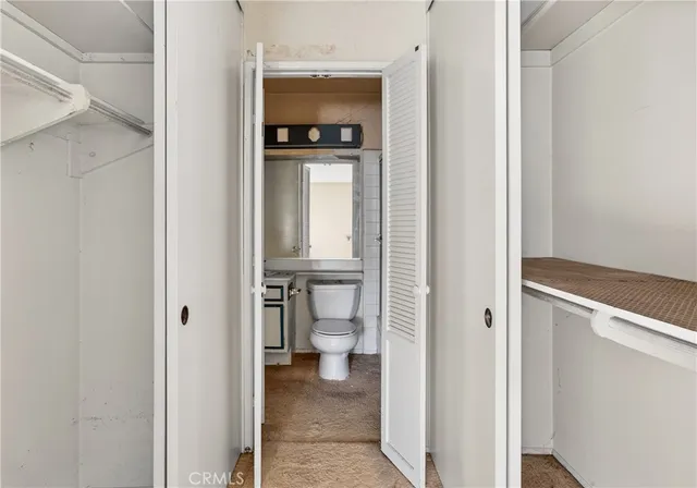 a view of a bathroom from the hallway