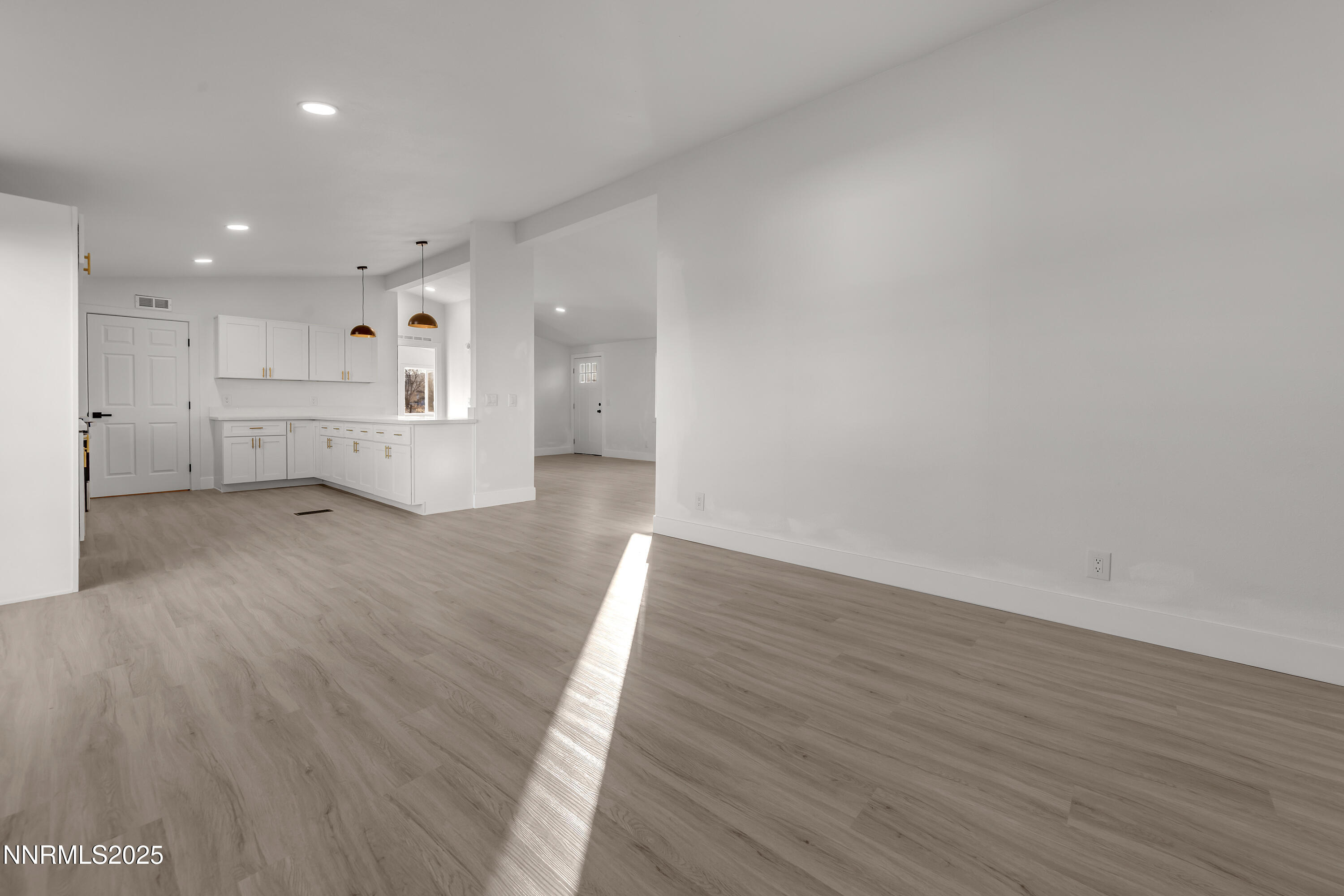 320 Ramsey Way Reno, NV 89506 - Photo 12 of 40 a view of empty room with wooden floor