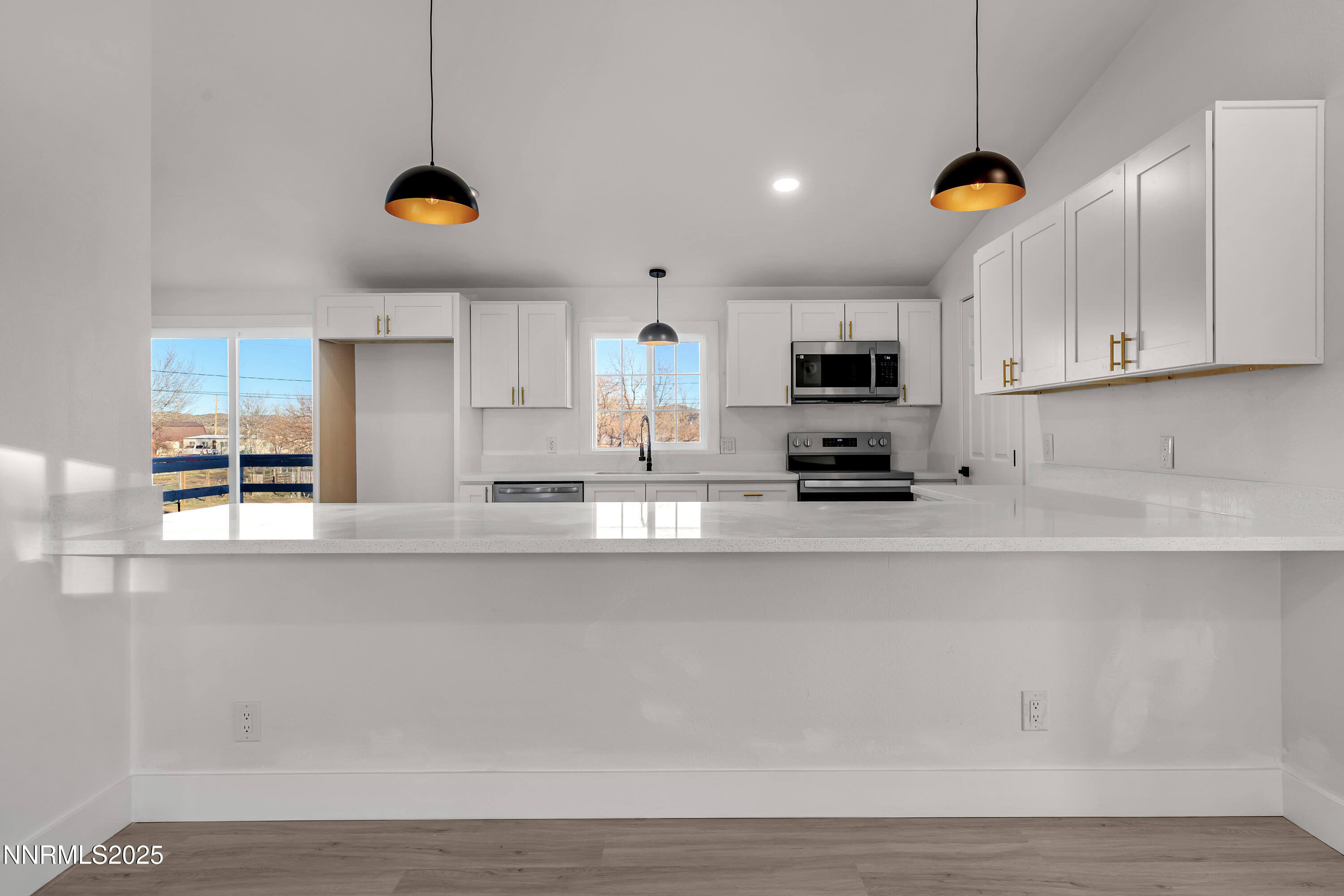 320 Ramsey Way Reno, NV 89506 - Photo 15 of 40 a kitchen with stainless steel appliances a stove a sink a microwave a counter top and cabinets