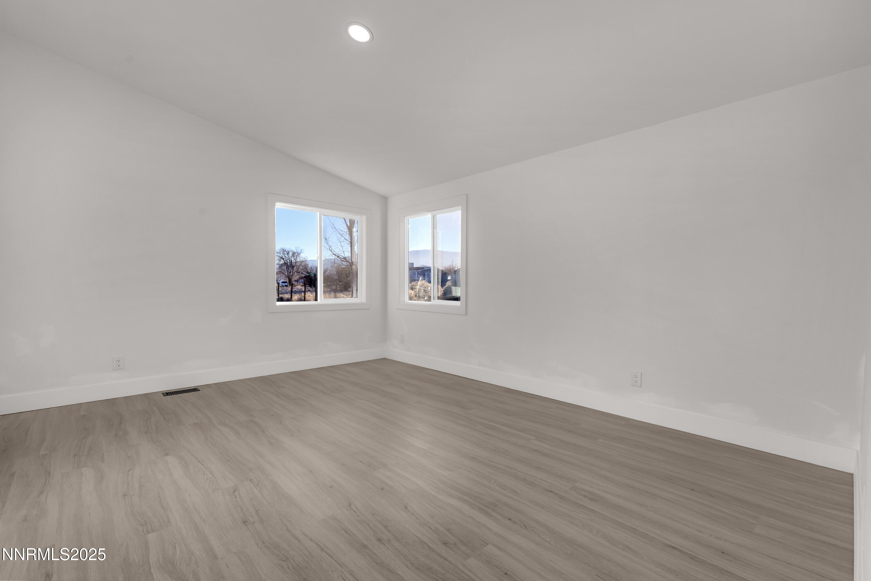 320 Ramsey Way Reno, NV 89506 - Photo 16 of 40 an empty room with wooden floor and windows