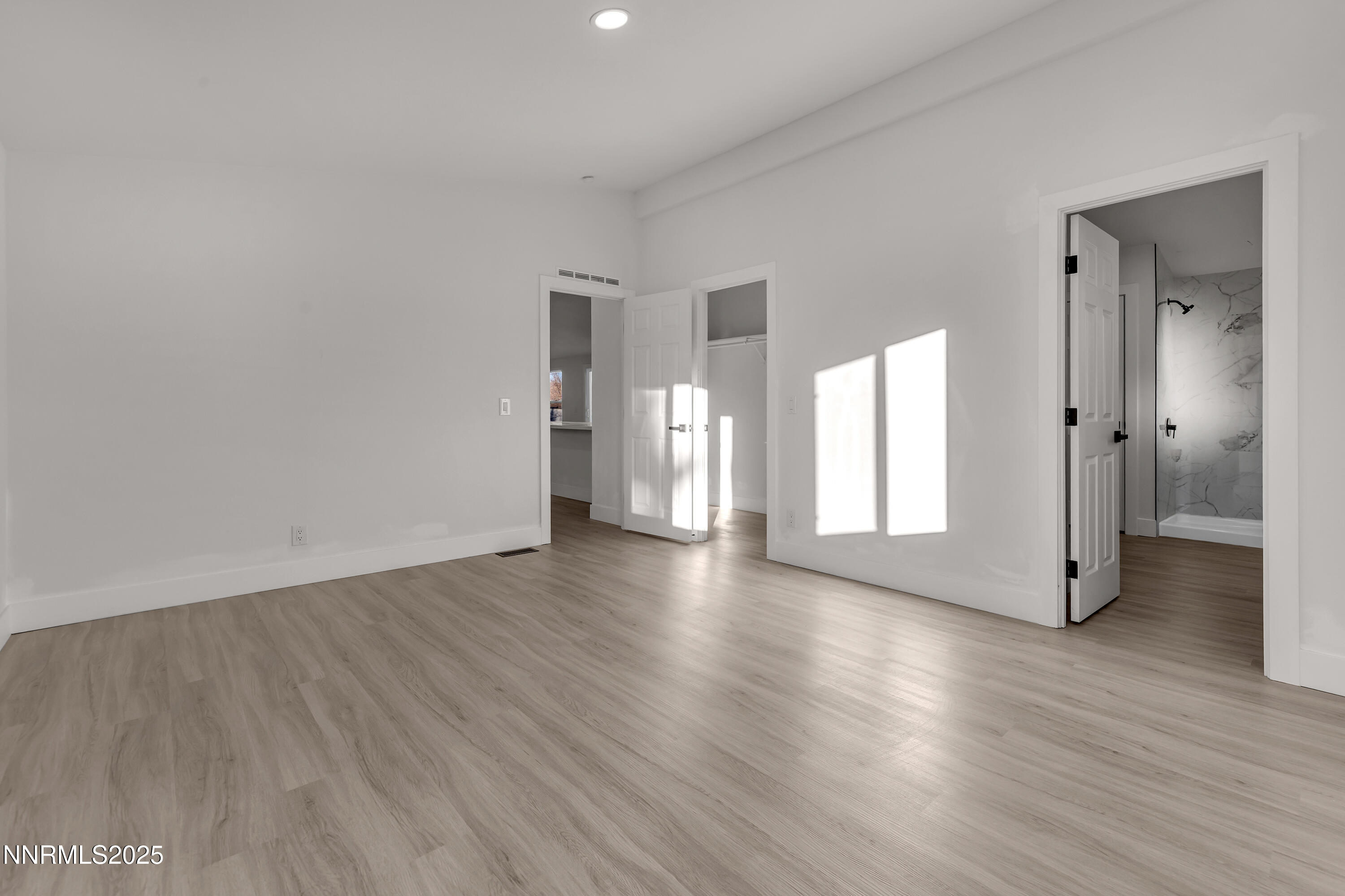 320 Ramsey Way Reno, NV 89506 - Photo 18 of 40 a view of empty room with wooden floor and window