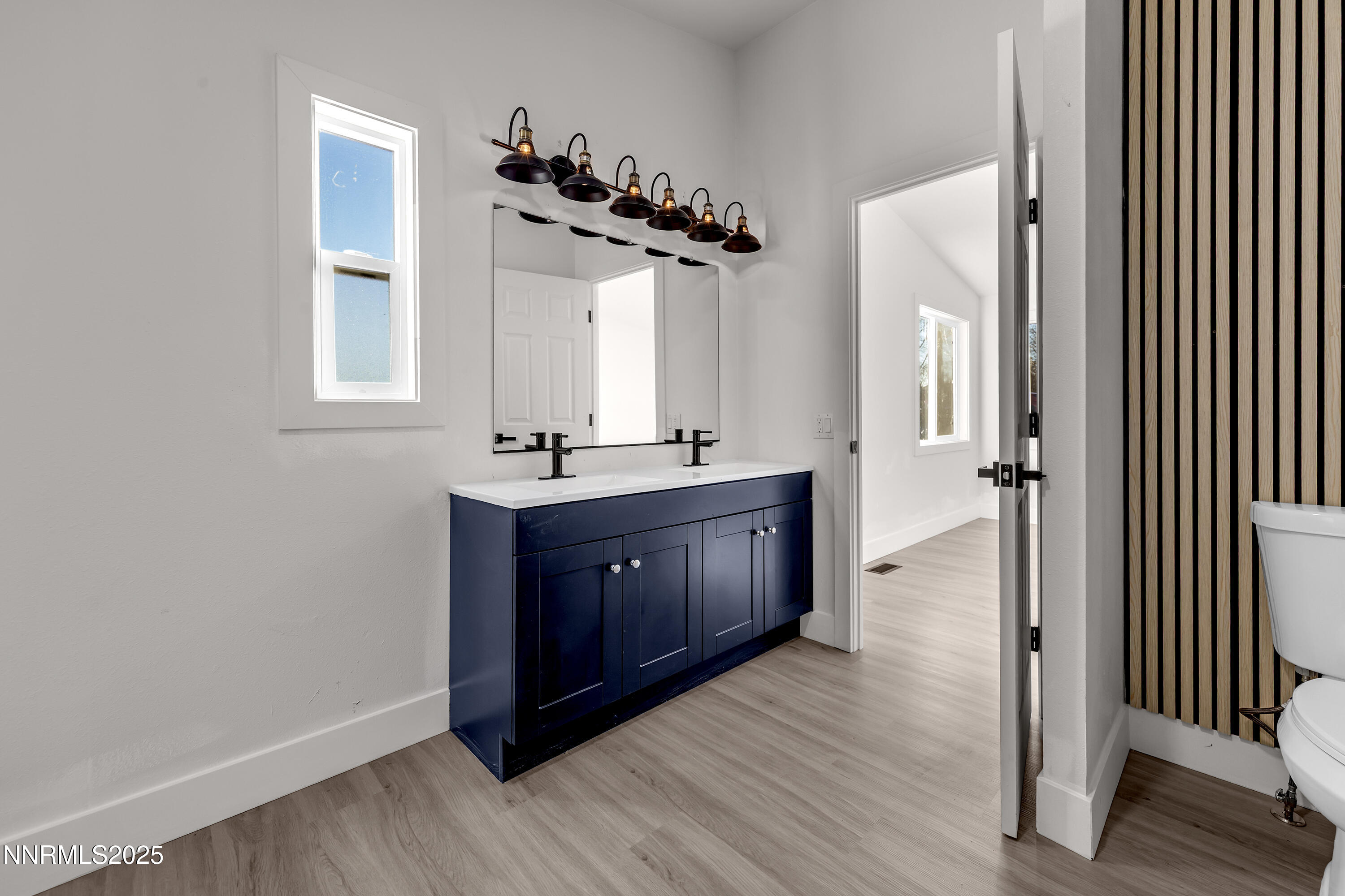 320 Ramsey Way Reno, NV 89506 - Photo 20 of 40 a bathroom with a double vanity sink and mirror