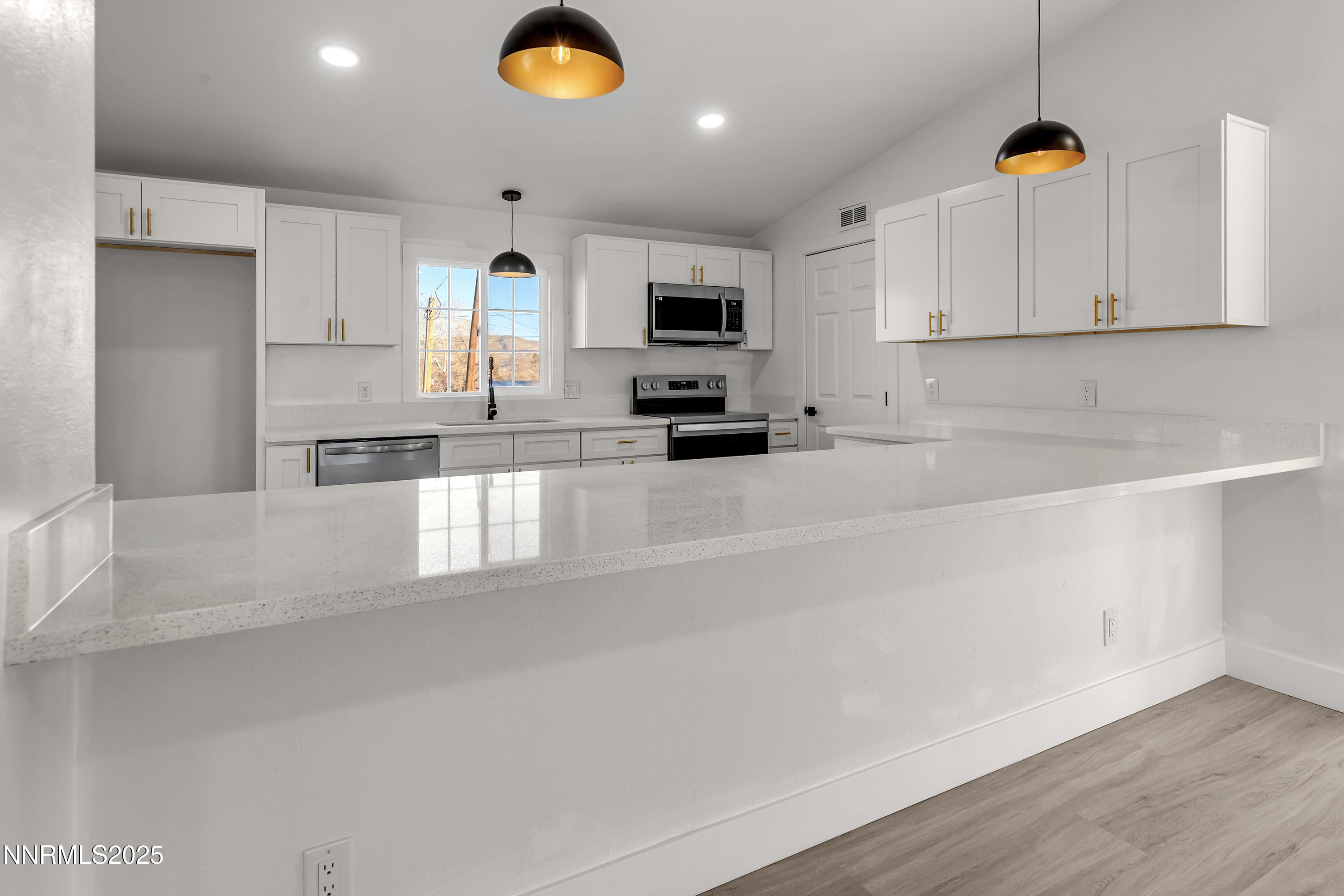 320 Ramsey Way Reno, NV 89506 - Photo 2 of 40 a kitchen with granite countertop a sink a stove and cabinets