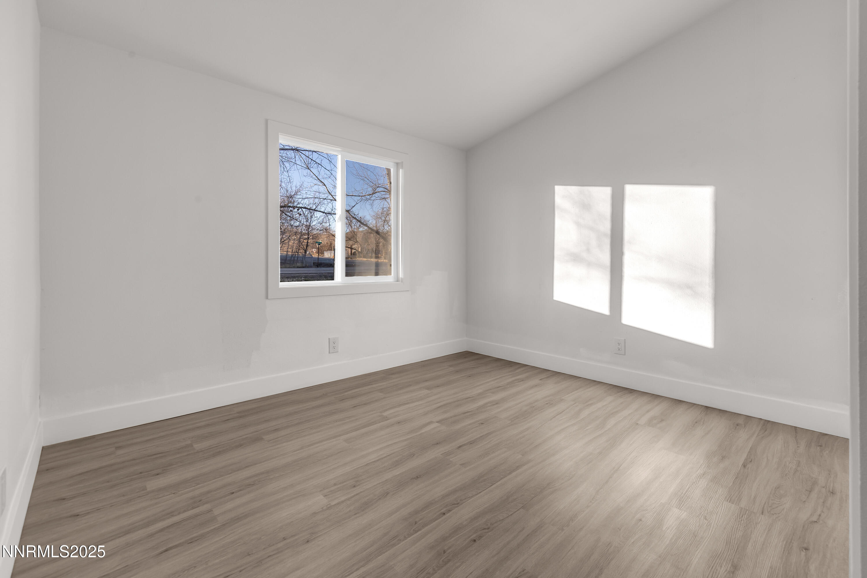 320 Ramsey Way Reno, NV 89506 - Photo 25 of 40 an empty room with wooden floor and windows