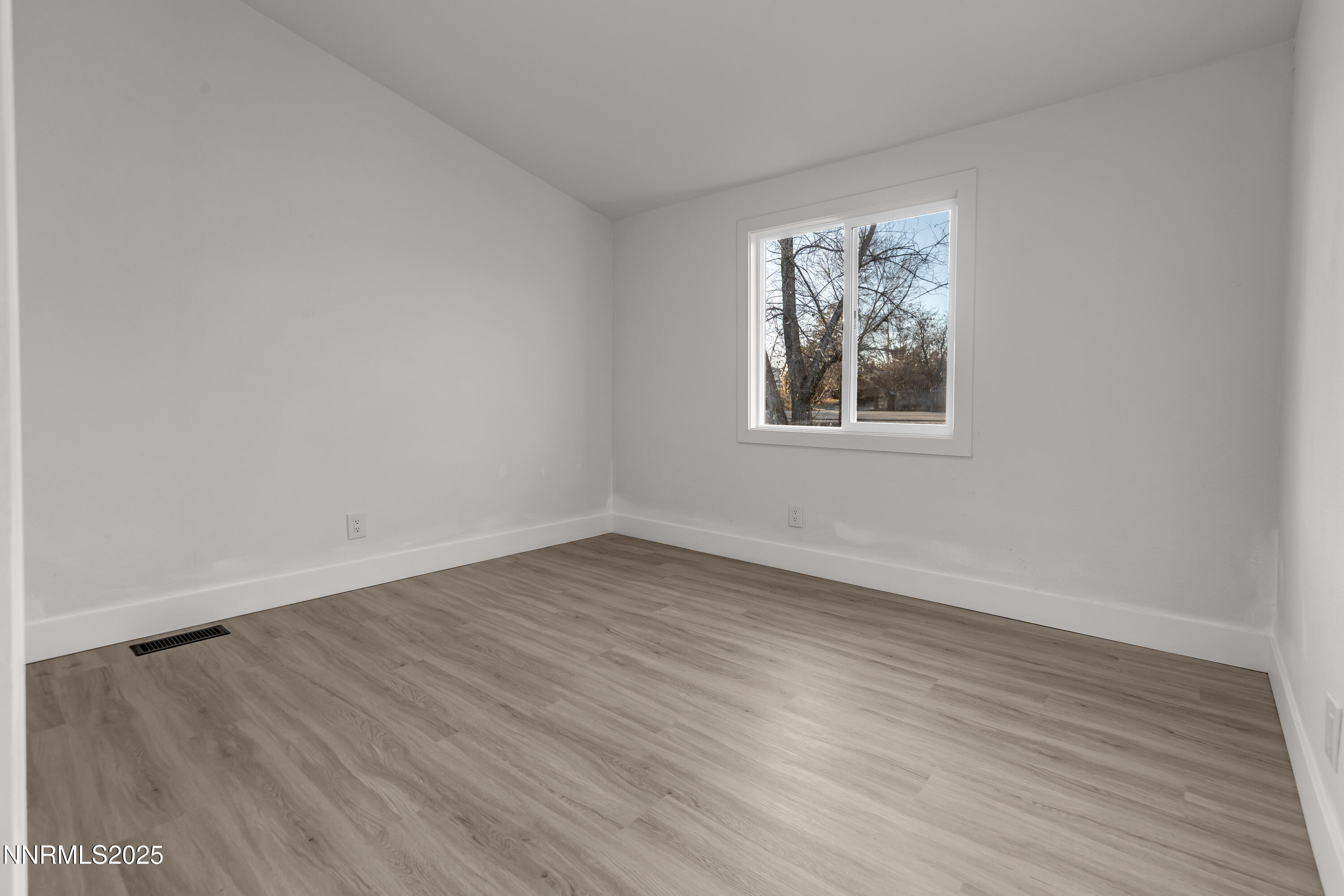320 Ramsey Way Reno, NV 89506 - Photo 27 of 40 wooden floor in an empty room with a window