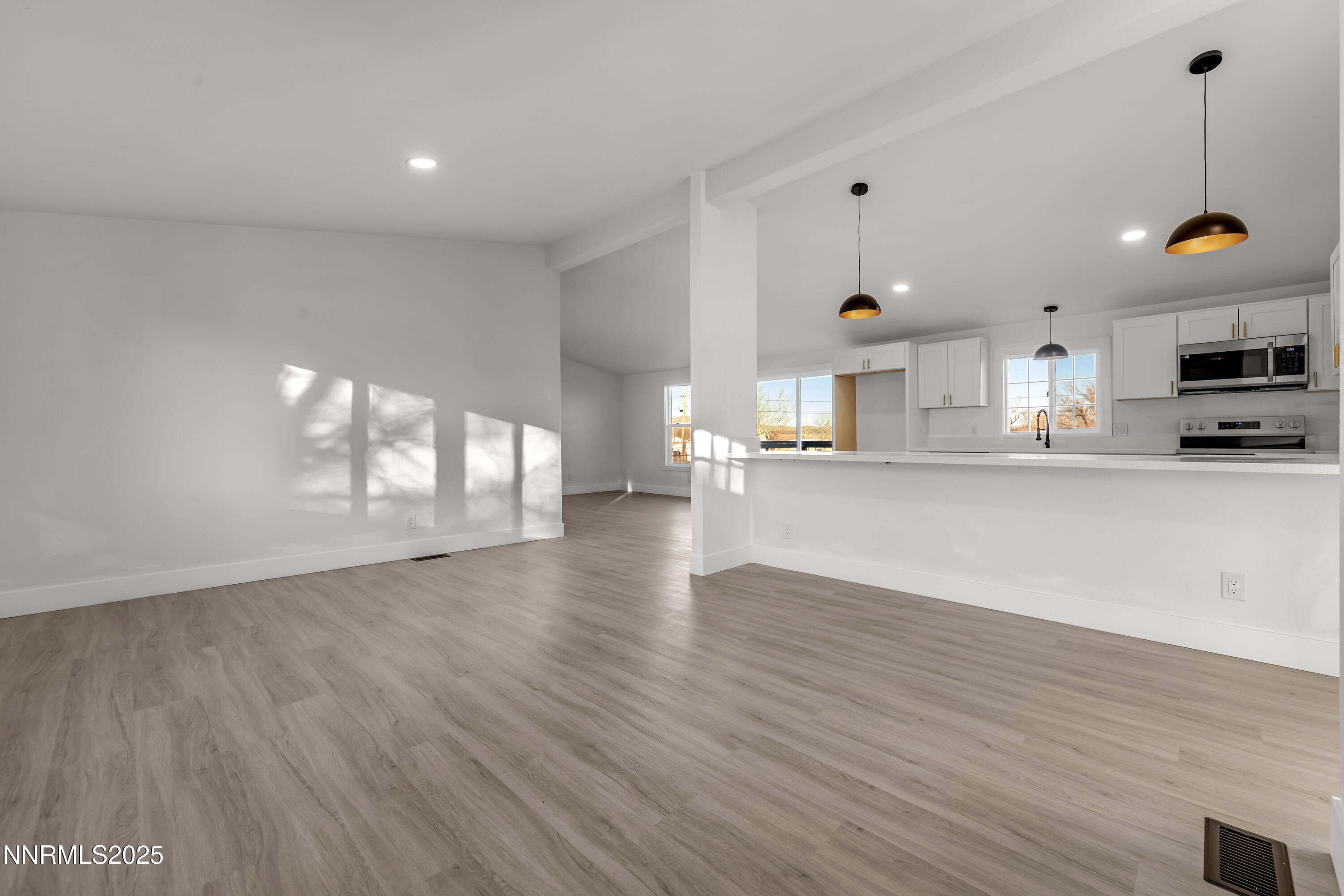 320 Ramsey Way Reno, NV 89506 - Photo 5 of 40 a view of a kitchen with furniture and wooden floor