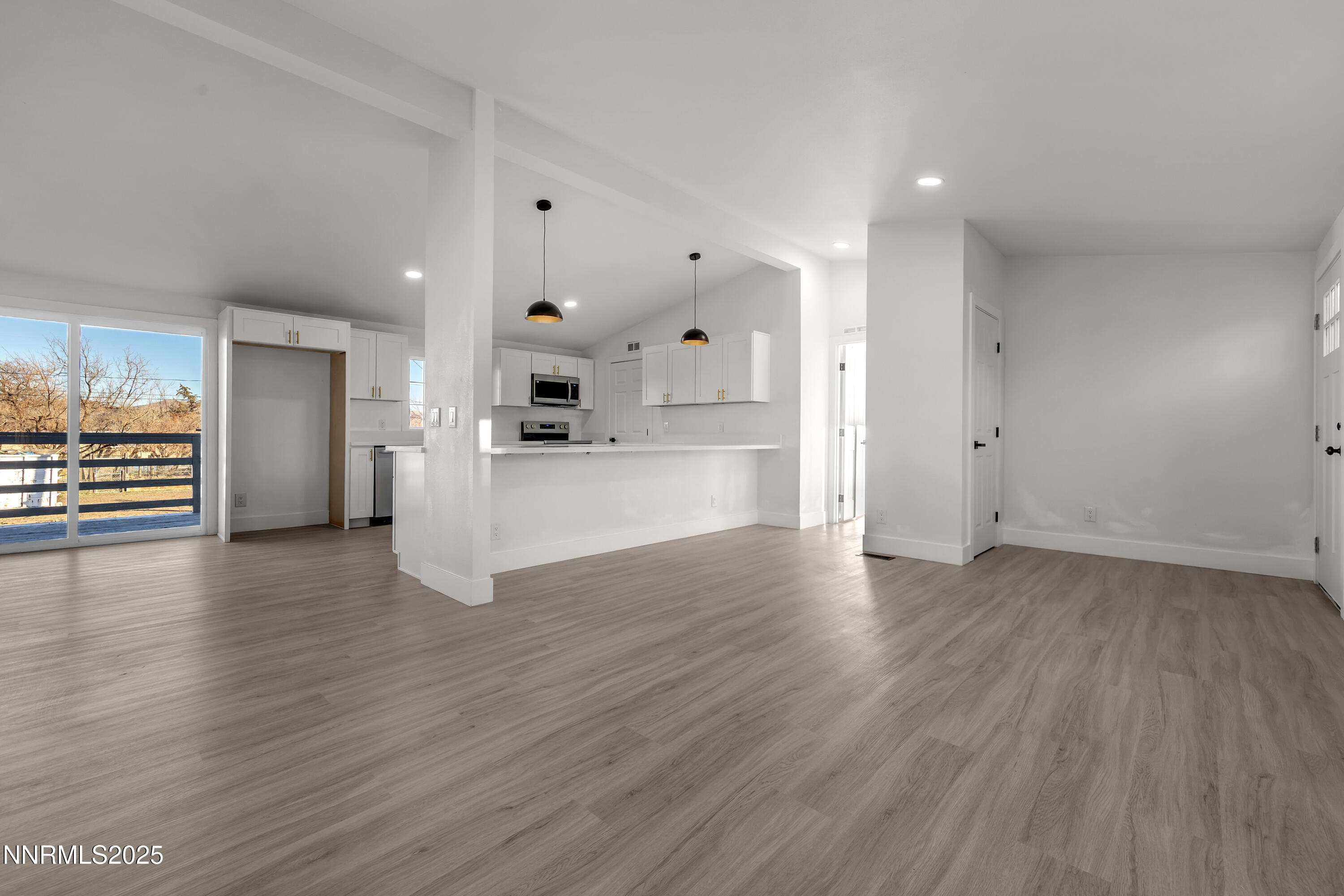 320 Ramsey Way Reno, NV 89506 - Photo 6 of 40 a view of a kitchen with a refrigerator and a stove top oven