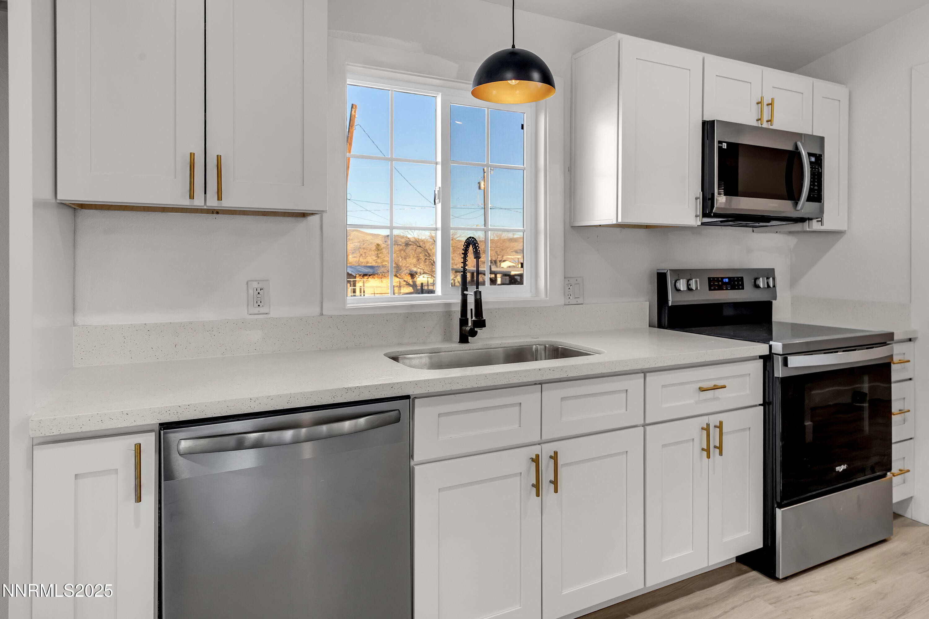 320 Ramsey Way Reno, NV 89506 - Photo 10 of 40 a kitchen with a sink stainless steel appliances and cabinets