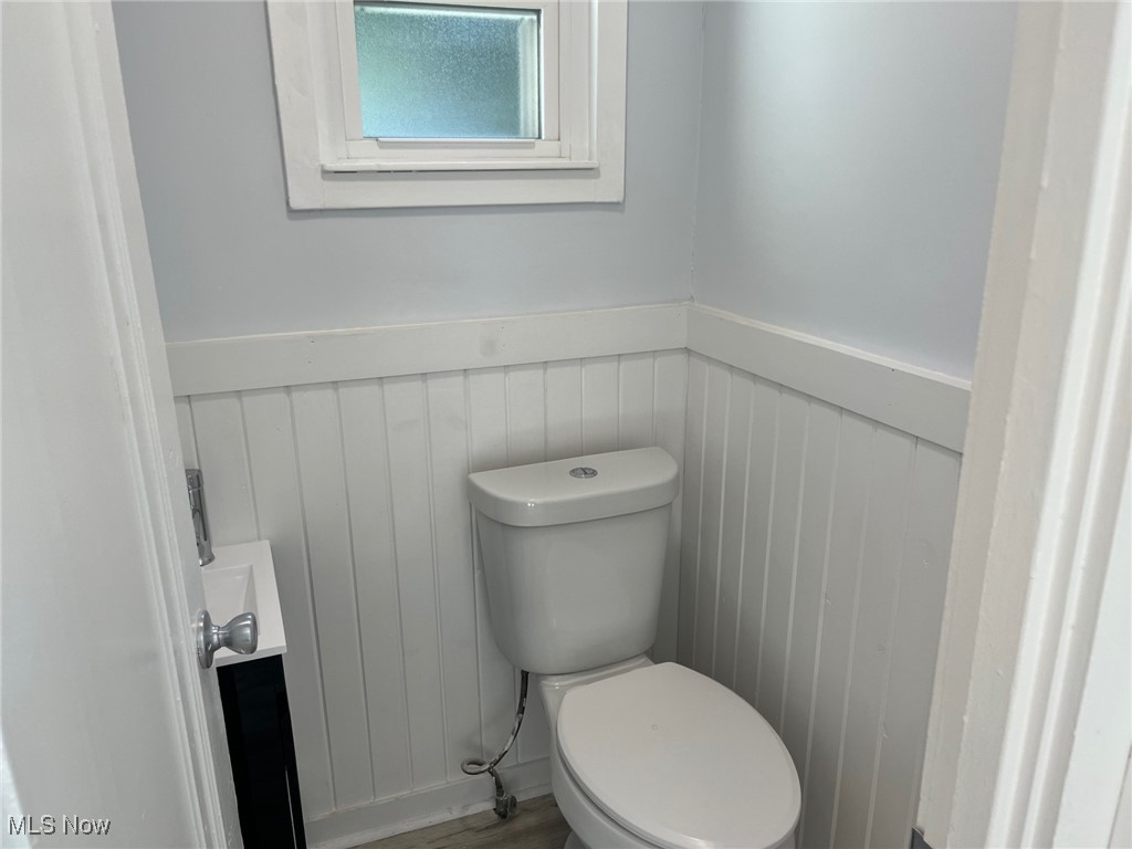 1148 Sylvania Road Cleveland Heights, OH 44121 - Photo 12 of 30 Half bath with a wainscoted wall and wood finished floors