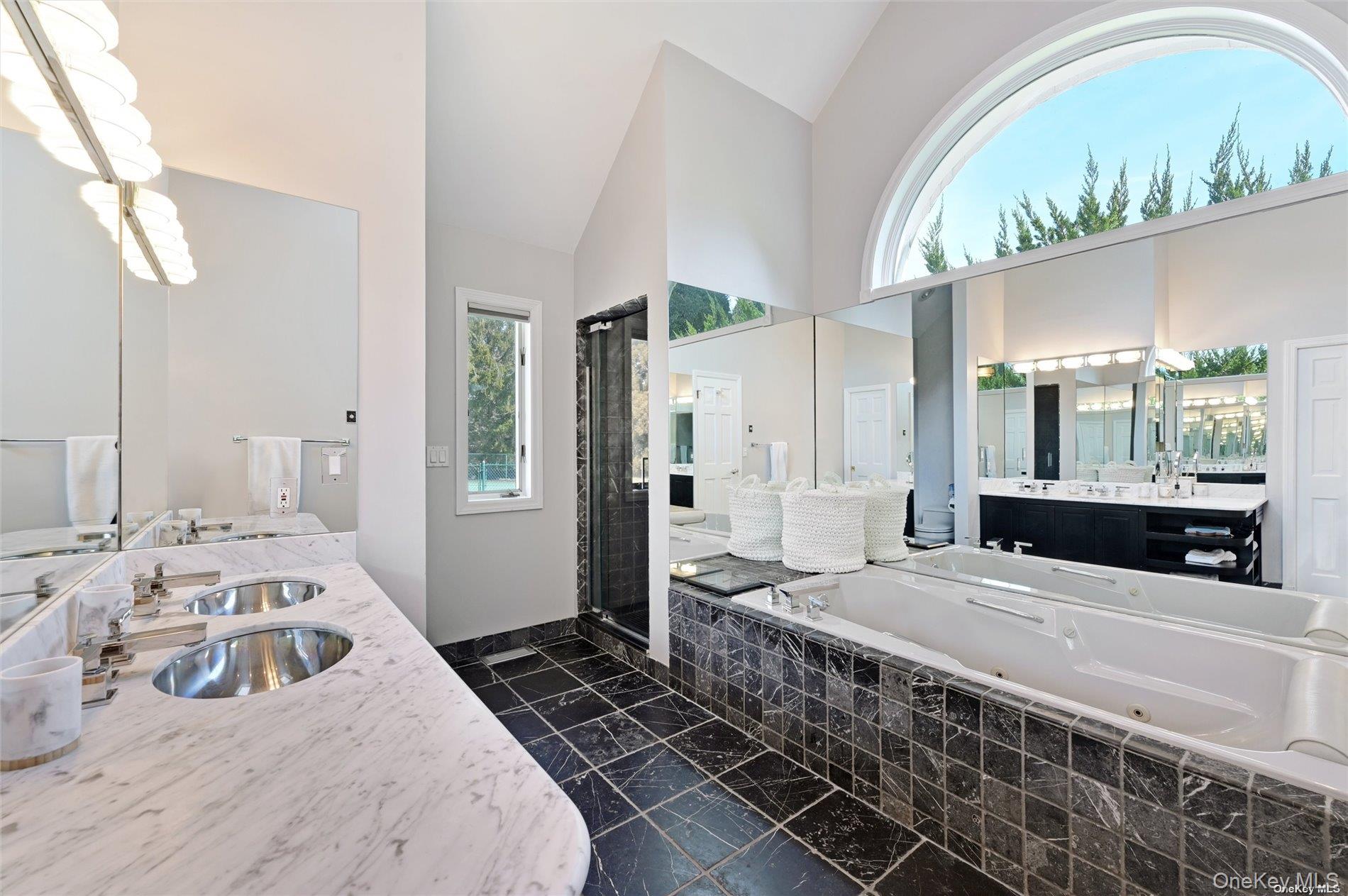 16 Laila Lane Remsenburg, NY 11960 - Photo 12 of 36 a bedroom with a bed a window and walk in closet