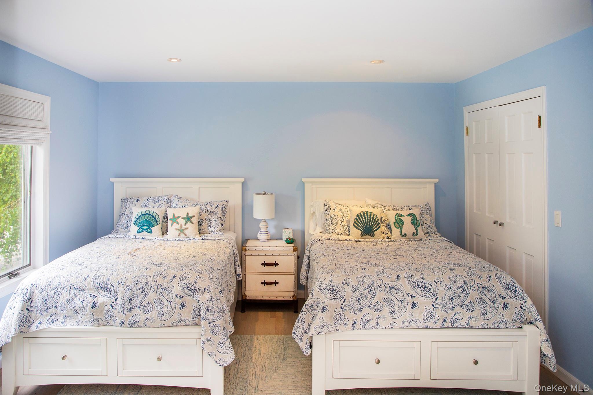 16 Laila Lane Remsenburg, NY 11960 - Photo 13 of 36 a bedroom with a bed and window