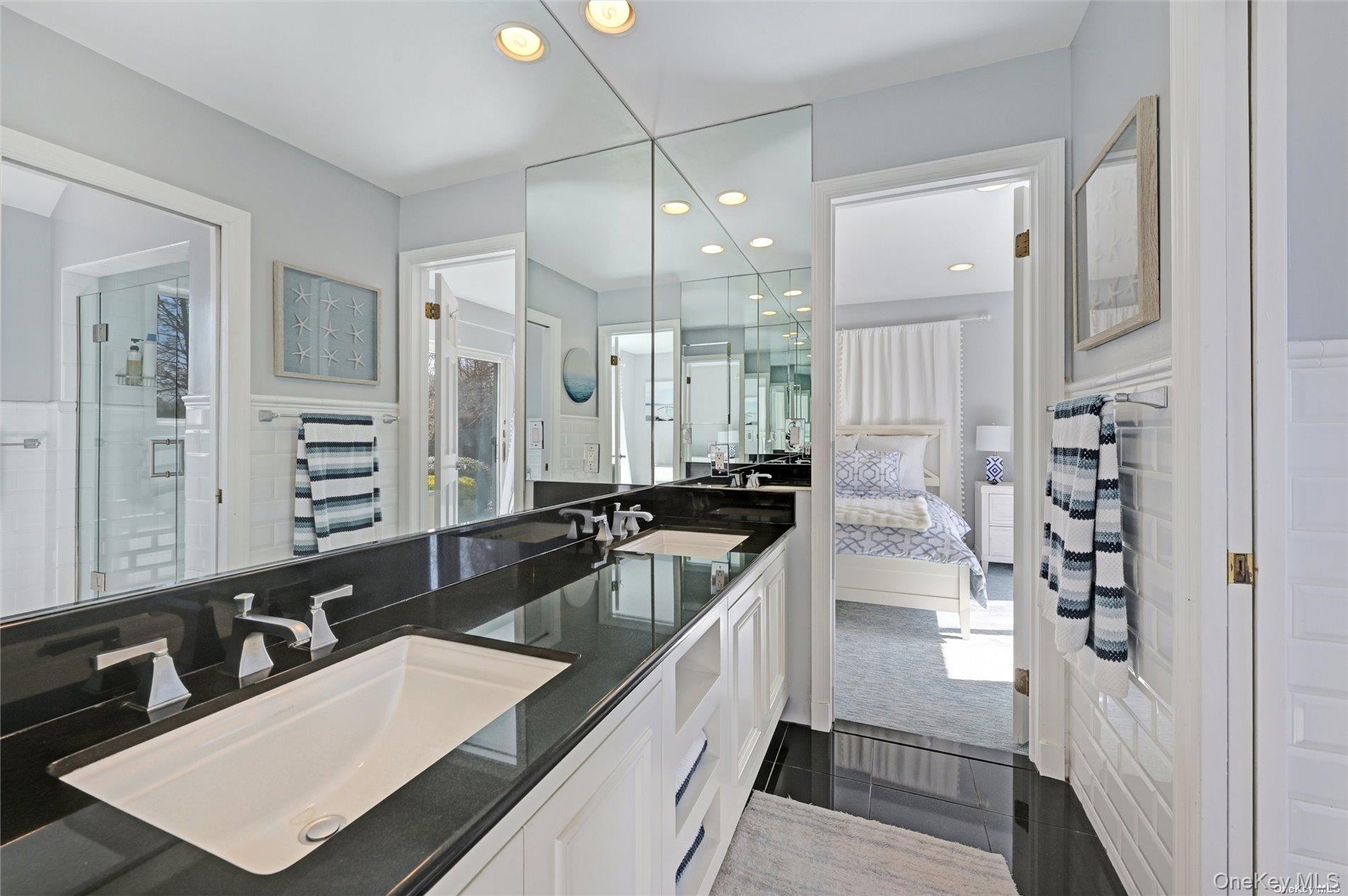 16 Laila Lane Remsenburg, NY 11960 - Photo 17 of 36 a large white kitchen with a large window and stainless steel appliances