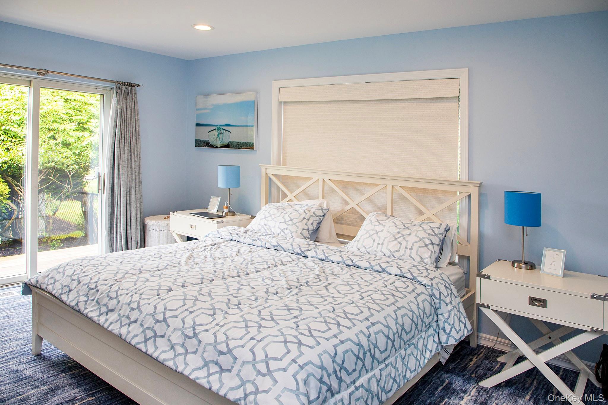 16 Laila Lane Remsenburg, NY 11960 - Photo 18 of 36 a bedroom with a bed and window