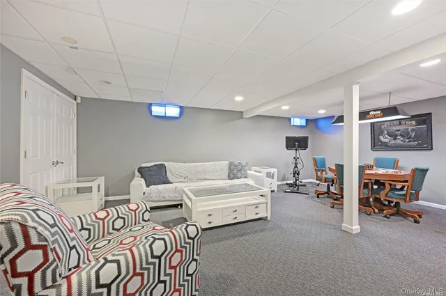 a living room with furniture and a chair