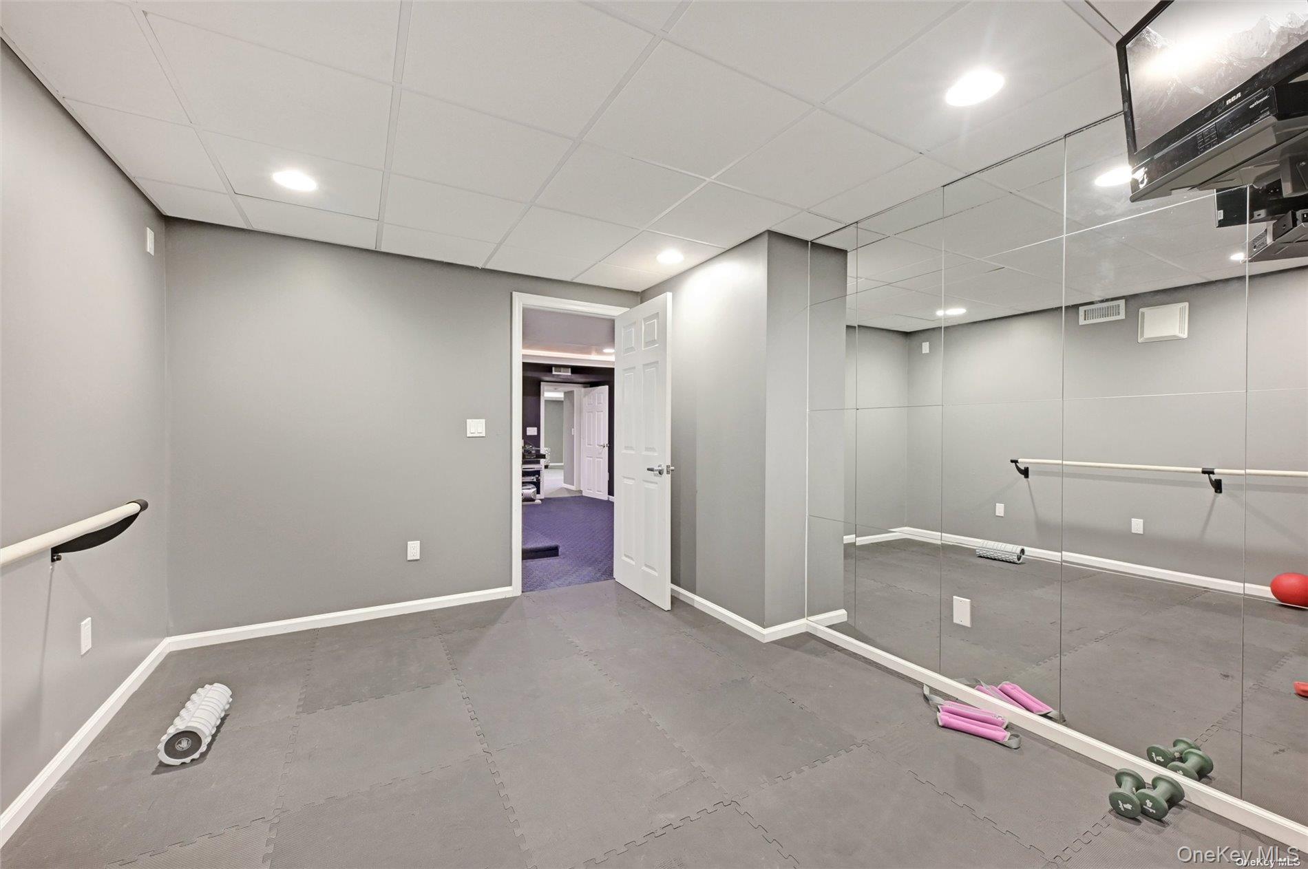 16 Laila Lane Remsenburg, NY 11960 - Photo 24 of 36 a view of a room with gym equipment