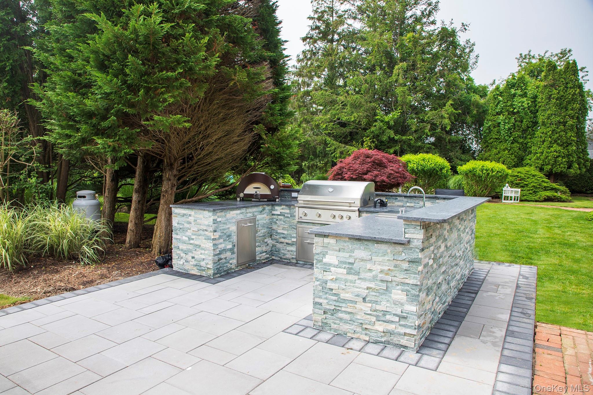 16 Laila Lane Remsenburg, NY 11960 - Photo 28 of 36 a view of a garden with an outdoor seating