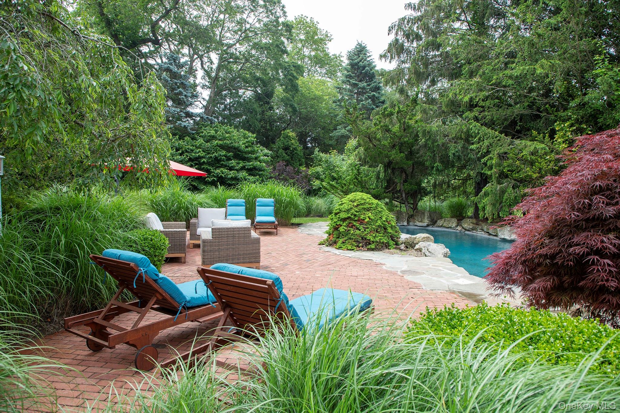 16 Laila Lane Remsenburg, NY 11960 - Photo 32 of 36 a view of a backyard with sitting area