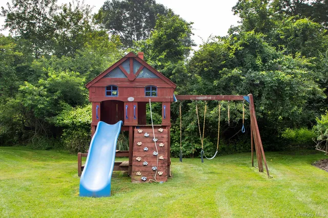 a view of a wooden deck with a backyard
