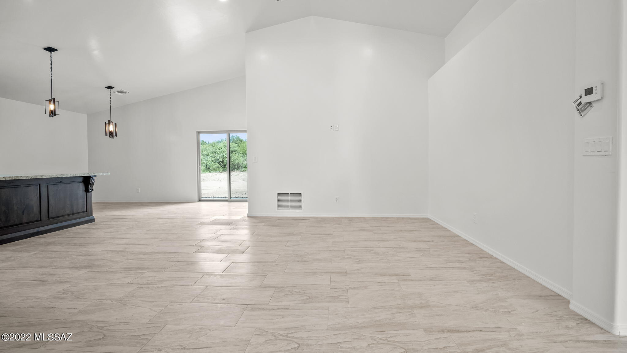 393 Quail Court Rio Rico, AZ 85648 - Photo 4 of 21 a view of an empty room with a window