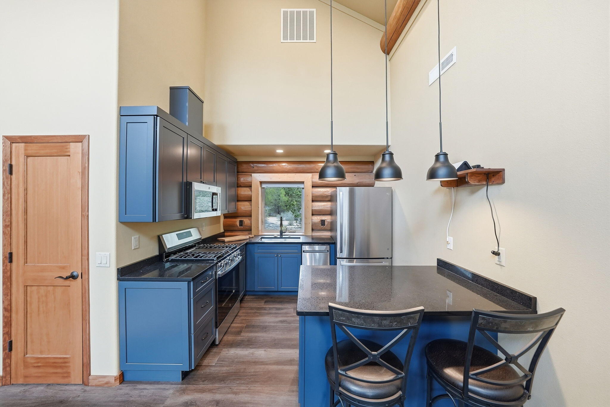 54270 Huntington Road La Pine, OR 97739 - Photo 8 of 68 a kitchen with stainless steel appliances a sink a stove and a refrigerator