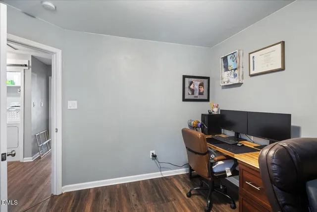 a workspace with furniture and wooden floor