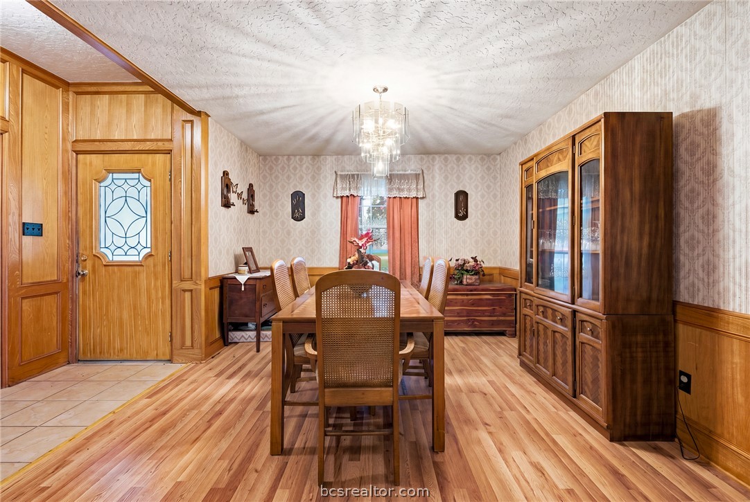 706 Mesquite Street Calvert, TX 77837 - Photo 11 of 23 a view of a a dining room with furniture window and wooden floor