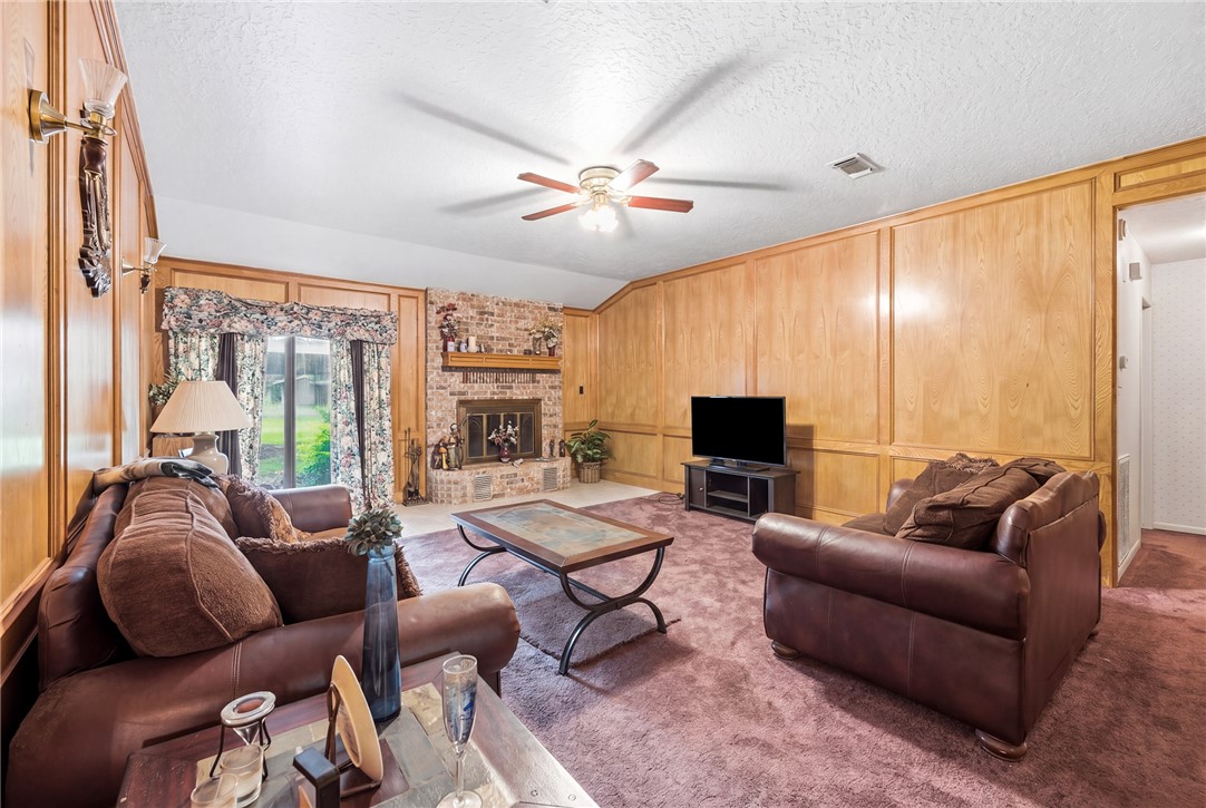 706 Mesquite Street Calvert, TX 77837 - Photo 14 of 23 a living room with furniture a ceiling fan and a large window