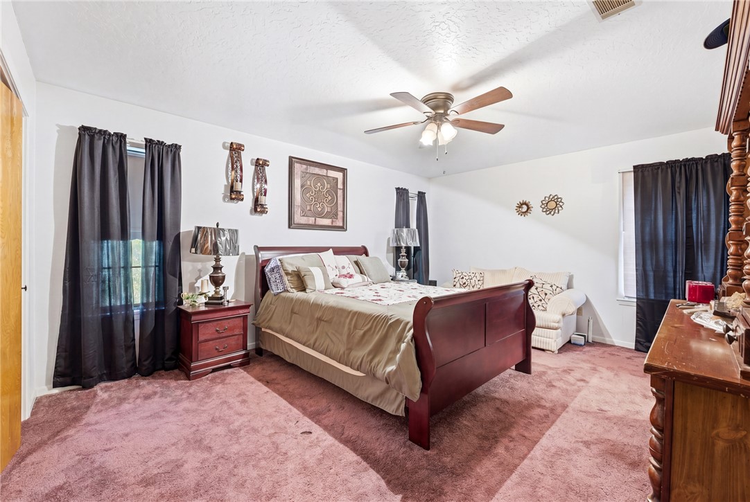 706 Mesquite Street Calvert, TX 77837 - Photo 15 of 23 a bed room with a bed and a window