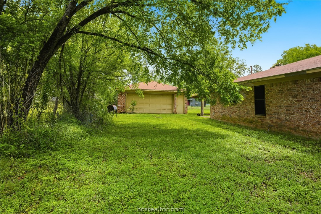 706 Mesquite Street Calvert, TX 77837 - Photo 4 of 23 a front view of a house with a yard