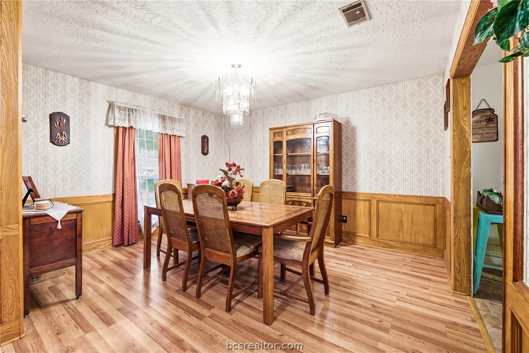 706 Mesquite Street Calvert, TX 77837 - Photo 9 of 23 a view of a dining room with furniture window and wooden floor