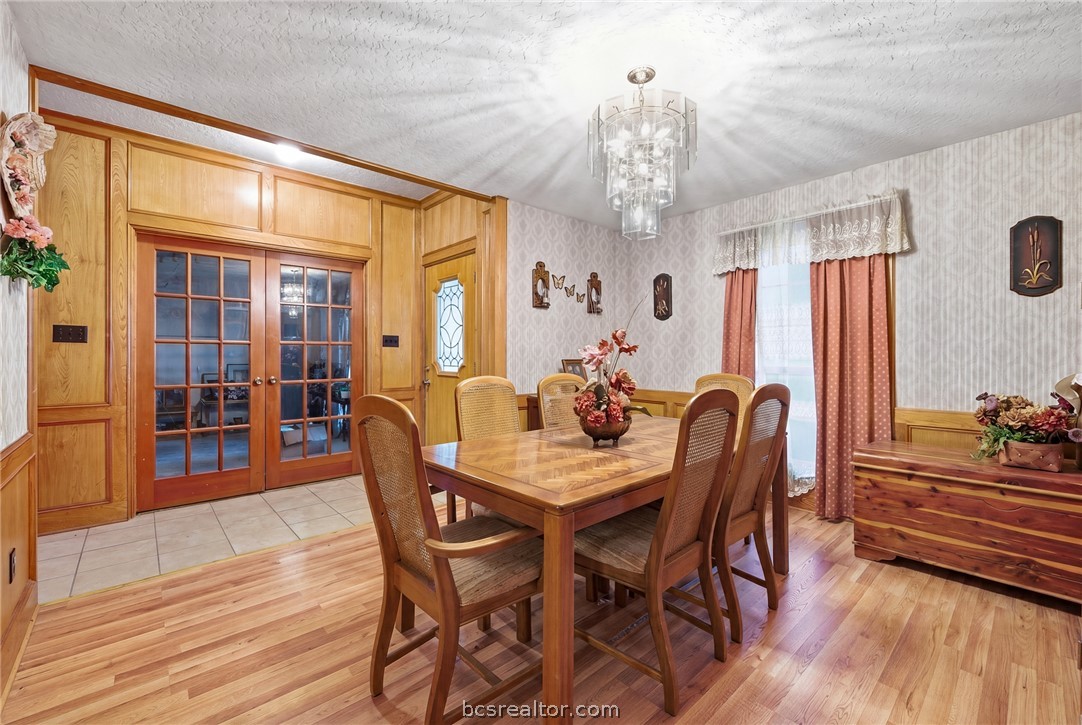 706 Mesquite Street Calvert, TX 77837 - Photo 10 of 23 a view of a dining room with furniture window and wooden floor