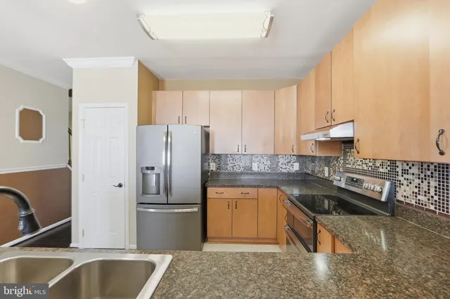 a view of living room with granite countertop furniture and a fireplace
