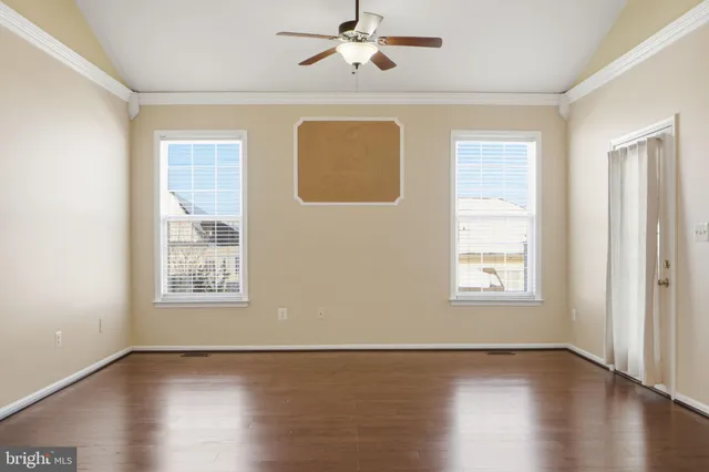 a view of a kitchen with a stove wooden floor and a kitchen space