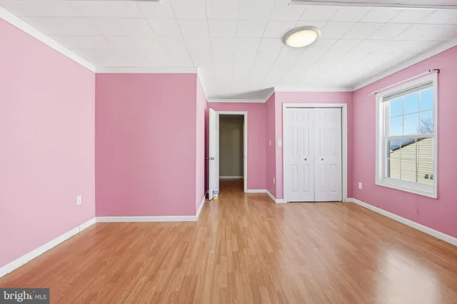 a view of entryway with wooden floor