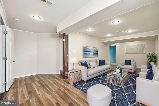 a room with furniture and wooden floor