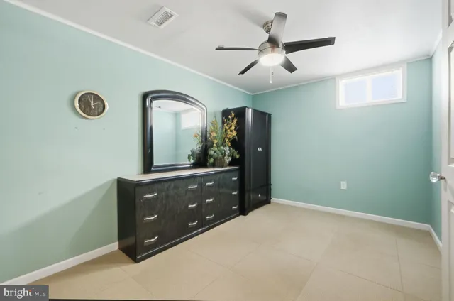 a bathroom with a granite countertop toilet a sink and a shower
