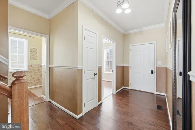 a bathroom with a wooden floor and a shower