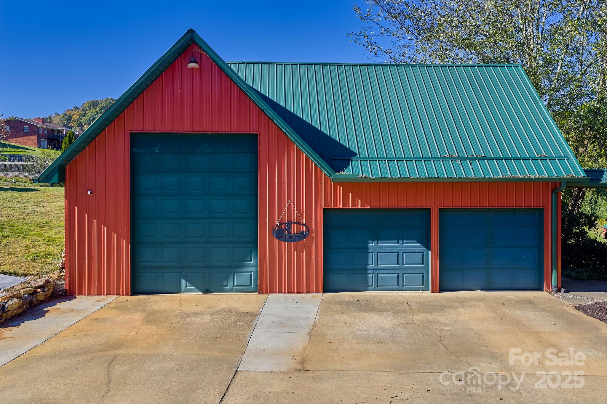 145 Keener Road Canton, NC 28716 - Photo 11 of 48 a front view of a house with a yard and garage
