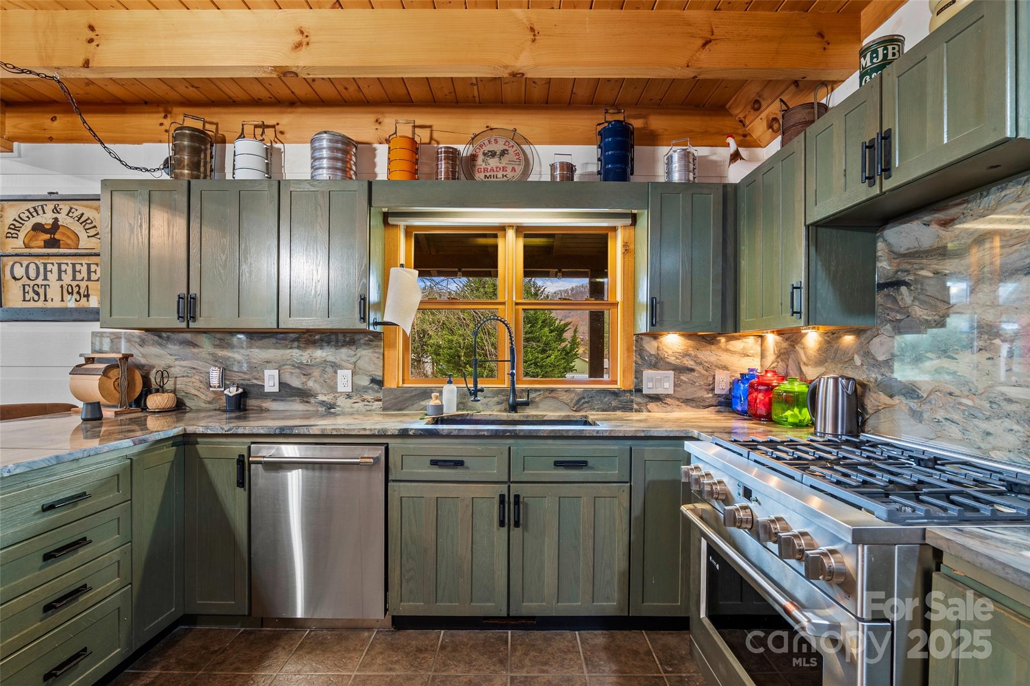 145 Keener Road Canton, NC 28716 - Photo 24 of 48 a kitchen with stainless steel appliances granite countertop a stove a sink and a microwave