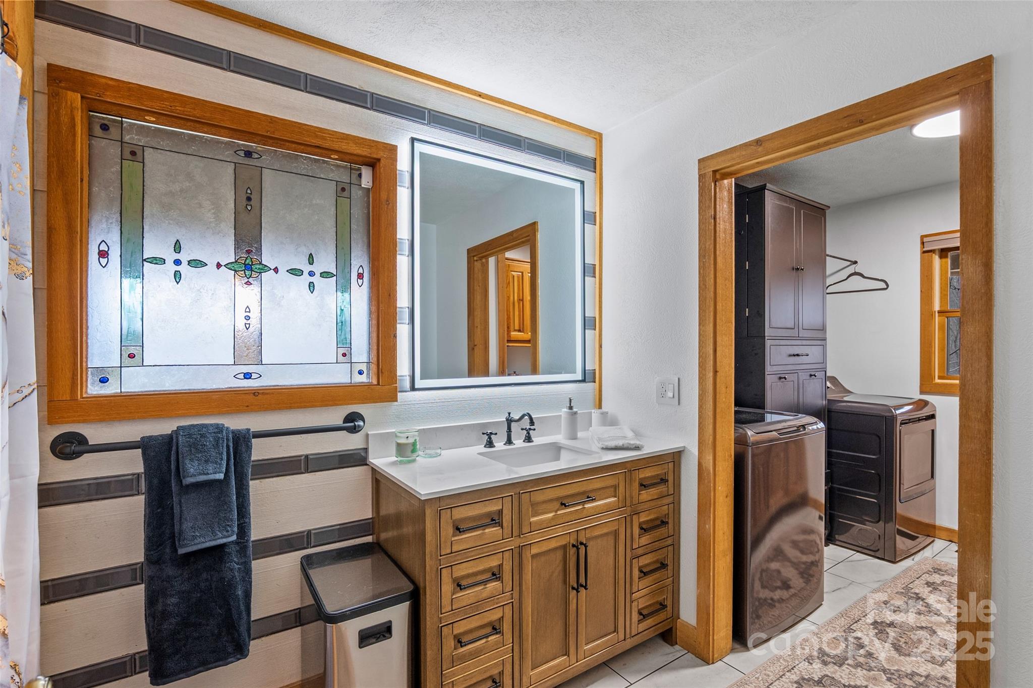 145 Keener Road Canton, NC 28716 - Photo 29 of 48 a bathroom with a sink double vanity and a mirror